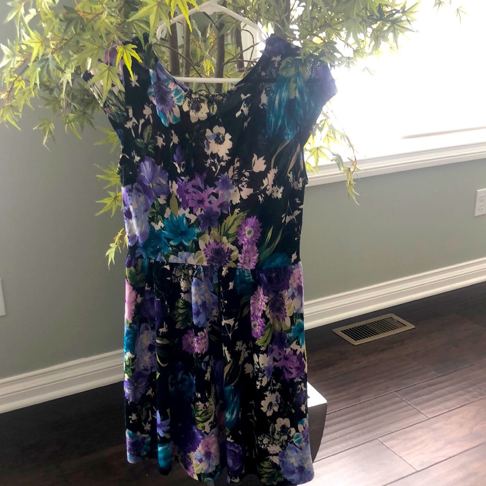 This is a mini dress by one clothing.The colors are blue,purple,white,and green